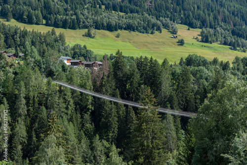 Landscape near Bellwald with the suspension bridge Goms Bridge photo