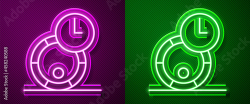 Glowing neon line Wooden barrel for wine icon isolated on purple and green background. Aging of wine in a barrel. Vector