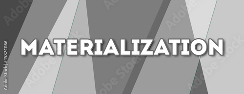 Materialization - text written on gray background photo