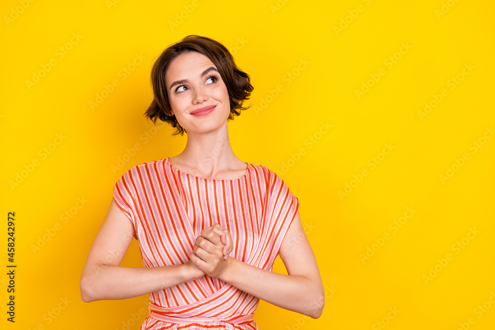 Fototapeta premium Portrait of attractive cheerful girl fantasizing copy space isolated over bright yellow color background