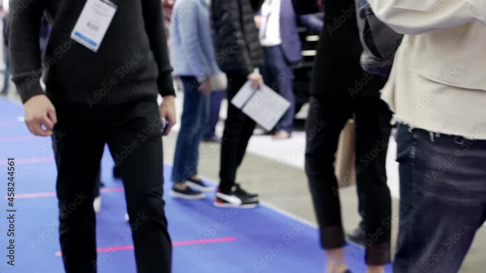 People walk past the camera.