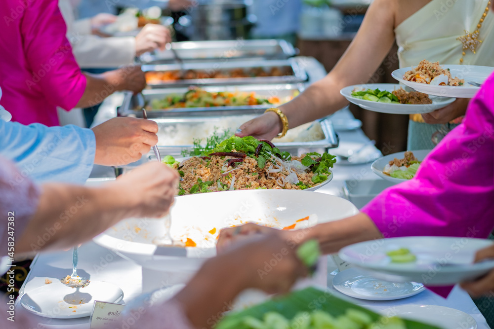 scooping the food, catering, dinner time
scooping the food, catering, dinner time