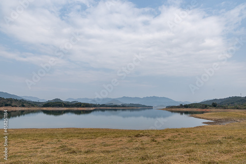 The view of the lake on a cloudy day in autumn