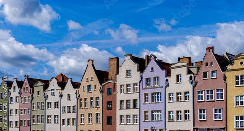 colorful house fronts of row houses on the riverfront of the Motlawa River in the Old Town of Gdansk