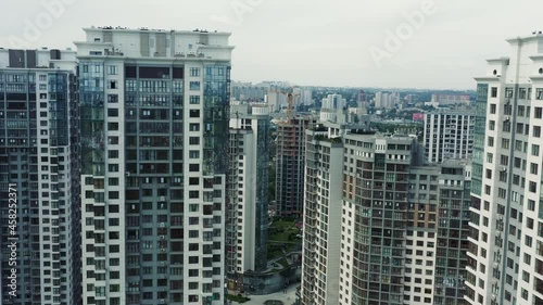Wallpaper Mural Aerial top down view of just finished modern neighborhood apartment building with solar panels on flat roof providing the residential part with renewable energy from the sun 4k high resolution Torontodigital.ca