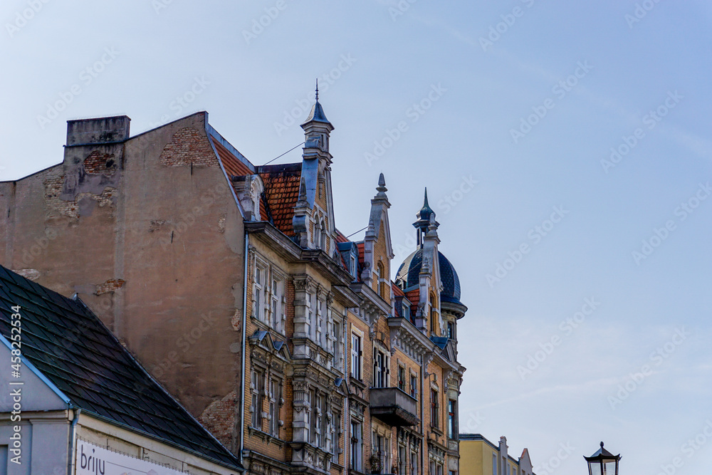 Naklejka premium typical Gothic architecture brick building in downtown Gniezno with elaborate architectural details