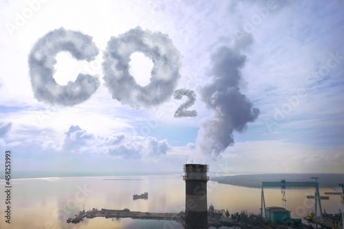 Inscription CO2 made of smoke. Aerial view of industrial factory