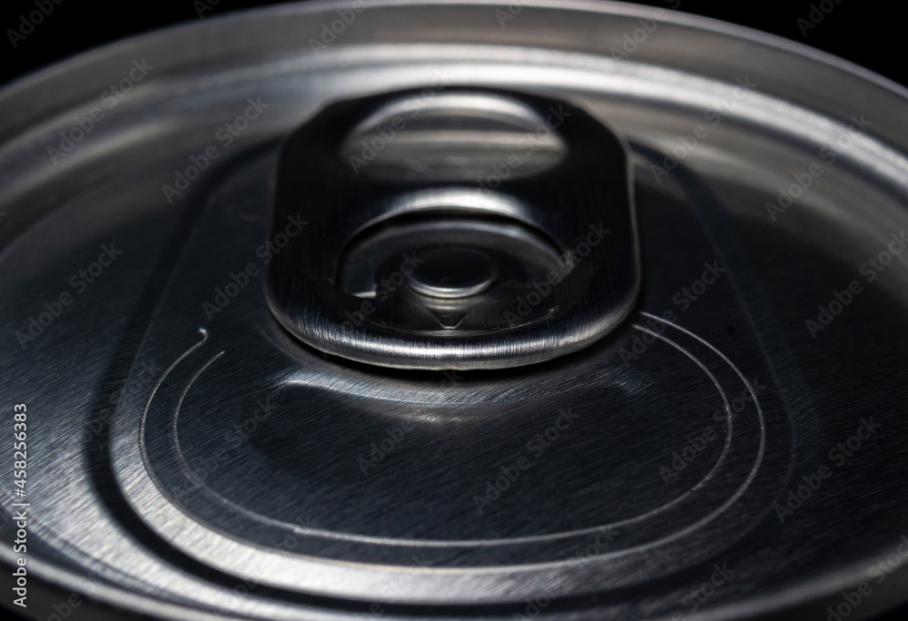 Close up lid of aluminum can in dark light Close up lid of aluminum can in dark light