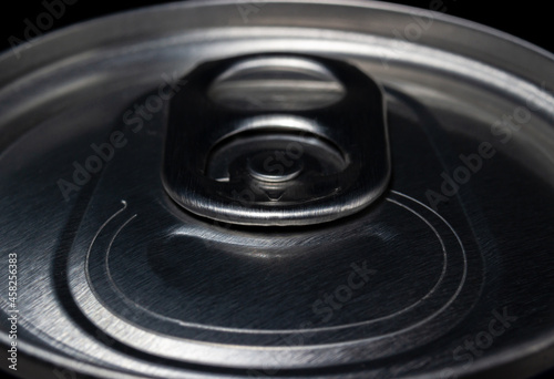 Close up lid of aluminum can in dark light