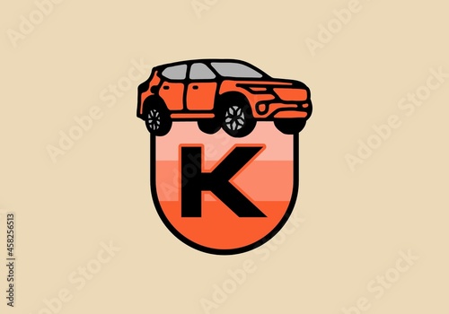 Line art illustration of car with K initial letter