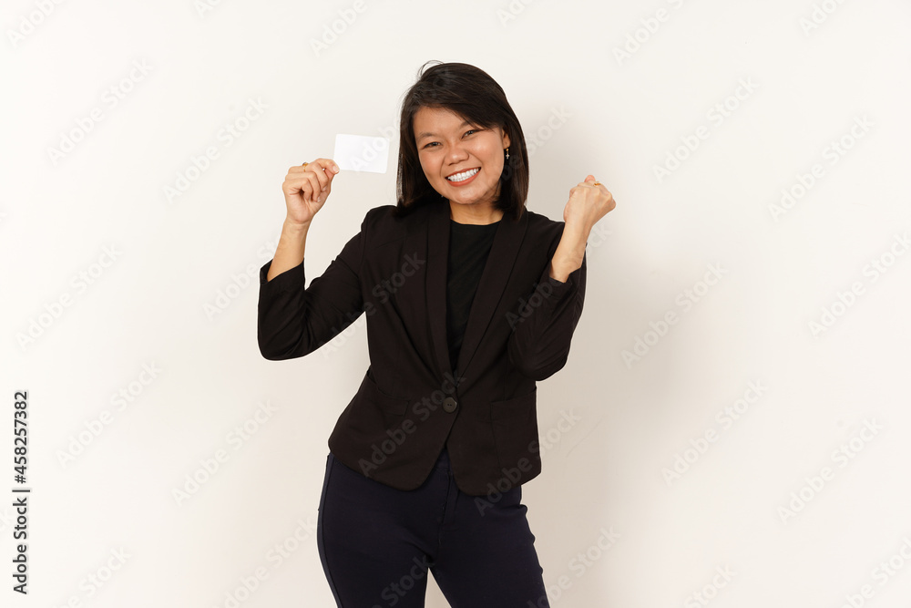 Happy Beautiful Asian Woman Wearing black suit Holding and showing blank credit card Isolated on white background Happy Beautiful Asian Woman Wearing black suit Holding and showing blank credit card Isolated on white background