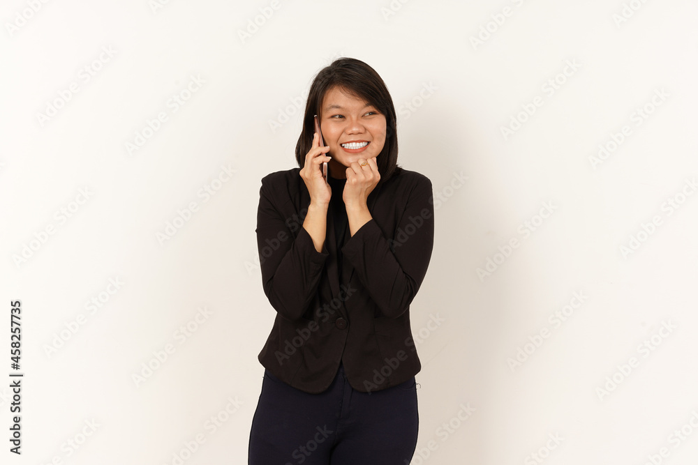 Beautiful Asian Woman Wearing black suit Talking on mobile phone with happy facial expression Isolated on white background Beautiful Asian Woman Wearing black suit Talking on mobile phone with happy facial expression Isolated on white background