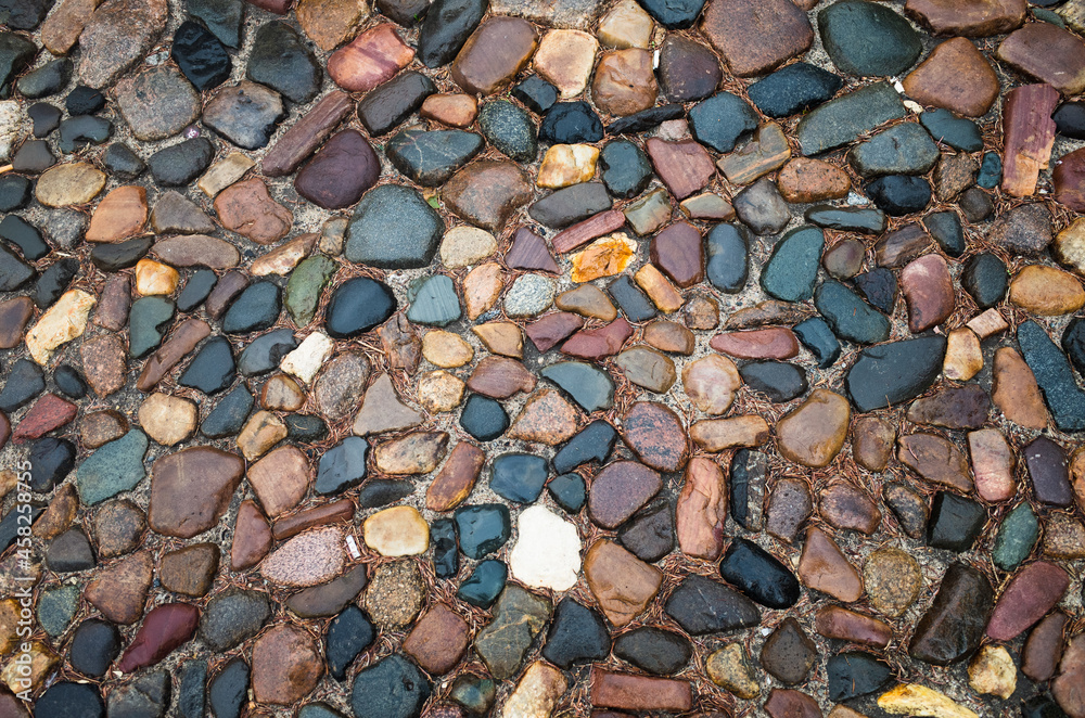 Textured beautiful natural abstract surface for wallpapers and backgrounds. Paving stones with round stones and earth between them Textured beautiful natural abstract surface for wallpapers and backgrounds. Paving stones with round stones and earth between them