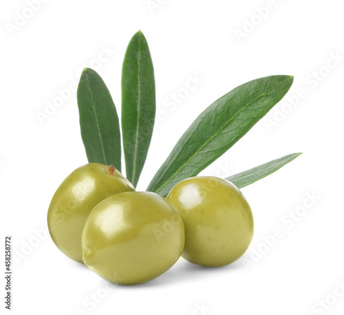Delicious fresh green olives with leaves on white background