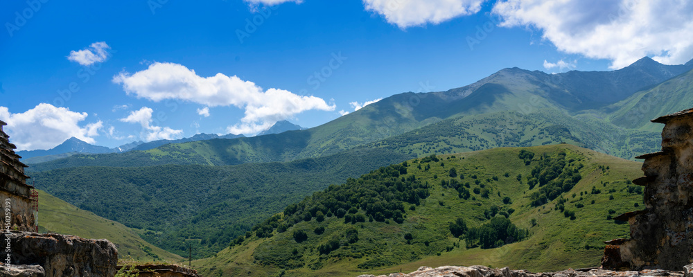 Mountains of North Ossetia, beautiful summer landscapes with blue sky and clouds.