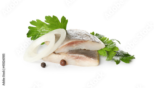 Obraz na płótnie Delicious salted herring slices with onion rings, peppercorns and parsley on whi