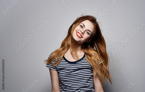 pretty woman holding hair makeup posing fun fashion model studio