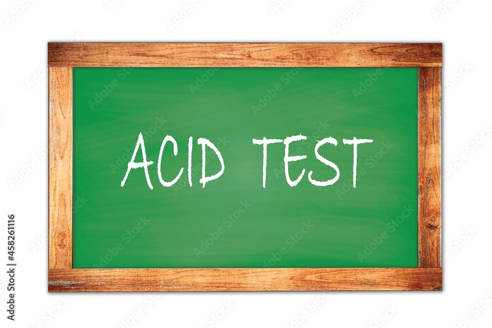 ACID  TEST text written on green school board.