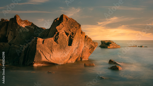 big rocks in sea at late day time