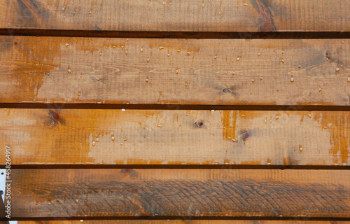 Raindrops on a wooden surface