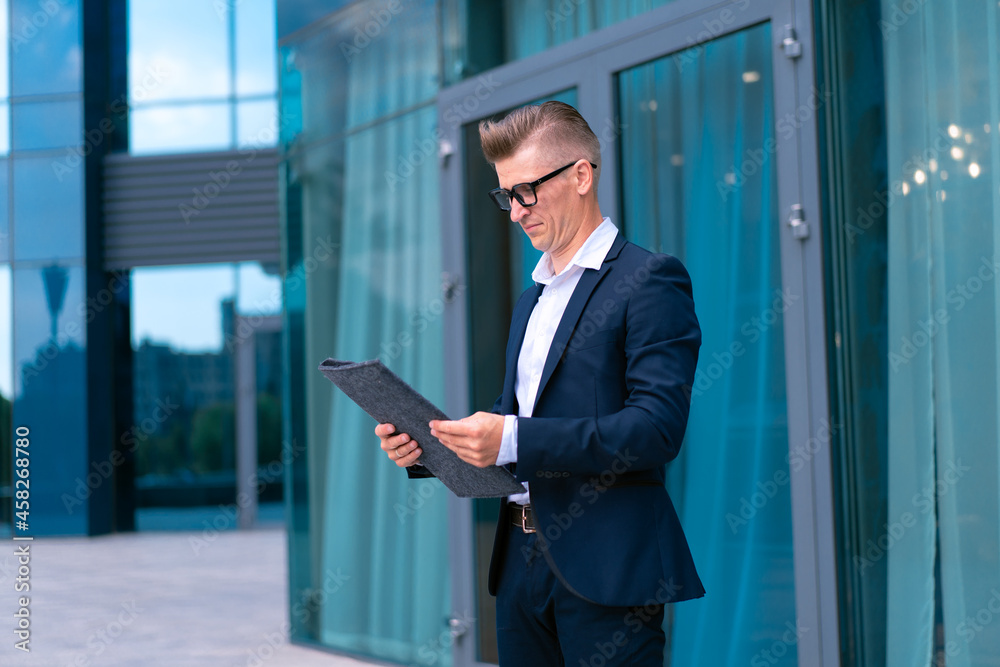 Fototapeta premium Business. Businessman Glasses Standing City Street Near Office Building .