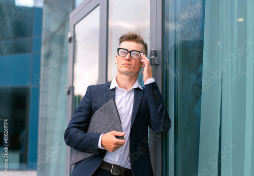 Business. Businessman Glasses Standing City Street Near Office Building .