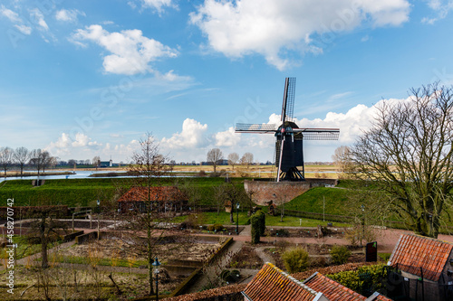 Windmill along the river Bergsche Maas in Heusden, Noord Brabant - The Netherlands - Europe photo