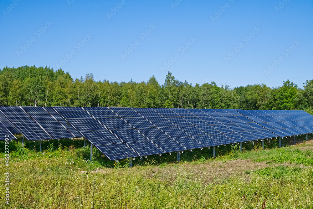 Solar power plant in summer day. Photovoltaic panels for renewable electric production. Solar panel power station landscape photography