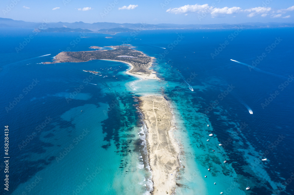 Island between sea with motorboats in summer Island between sea with motorboats in summer