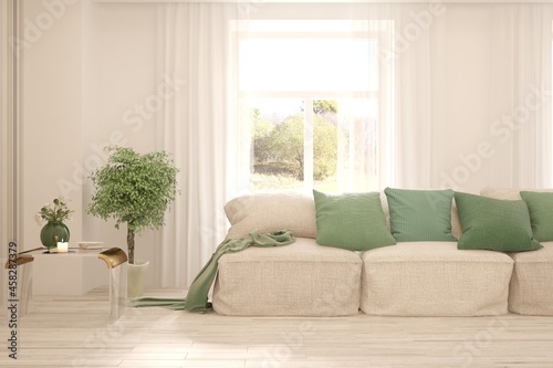 Stylish room in white color with sofa and autumn landscape in window. Scandinavian interior design. 3D illustration