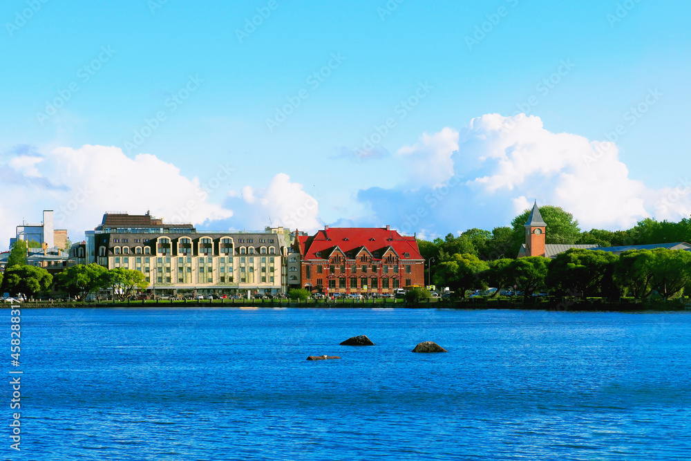 Vyborg Bay. Embankment with ancient beautiful buildings, city Vyborg, Russia, summer sunny day