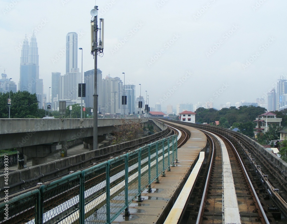 train track and transmission towerat malaysia background  petronas twin tower