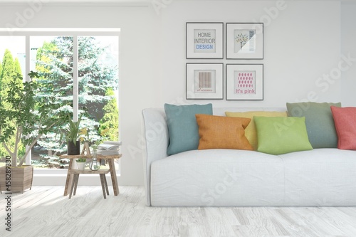 White living room with sofa and summer landscape in window. Scandinavian interior design. 3D illustration