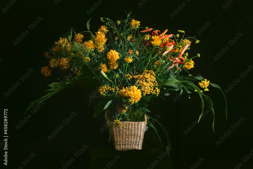 A fancy bouquet of yellow wildflowers with lilies on a dark background. Still-life. In the style of ancient Dutch masters. Large format for printing paintings in the interior