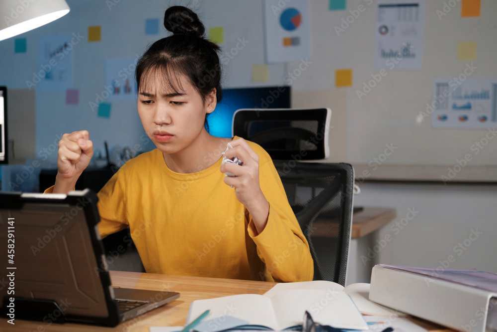 Angry overworked young woman in home office. Angry overworked young woman in home office.