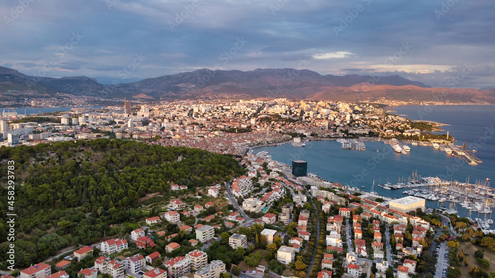 Aerial view of the sea coast and houses in Split. Historical Center,  Adriatic Sea and mountains. Yachts in the marina. Drone Photo. Dalmatia. Croatia. Europe