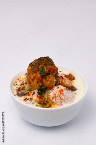 Dahi wada or dahi bhalla. This is delicious indian style food. photo