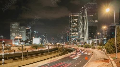 NIght city timelapse, highway traffic, skycrapers horizon in Tel Aviv Yafo, Israel