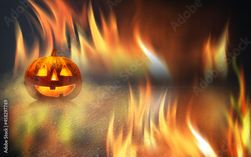 Dark fire background Halloween. Glowing lantern pumpkin on the background of neon glow, flames