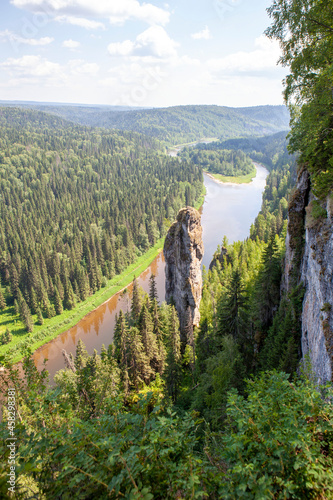 The picturesque Devil's Finger rock overlooking the Usva River. Massif Usvinskie Pillars. Perm Territory. Russia photo