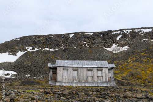 Russian research and polar expedition base in Tikhaya Bay (Tikhaya Bukhta) on Franz Josef Land archipelago. Wooden buildings in Arctic. photo