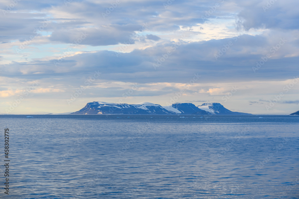 Arctic landscape in summer time. Franz Jozef Land archipelago. Flora cape, Gukera island. Arctic landscape in summer time. Franz Jozef Land archipelago. Flora cape, Gukera island.