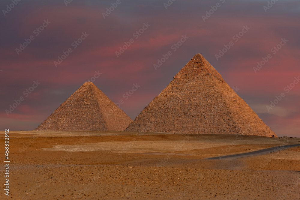 Two great Egyptian pyramids on the plateau of Giza under a picturesque sky