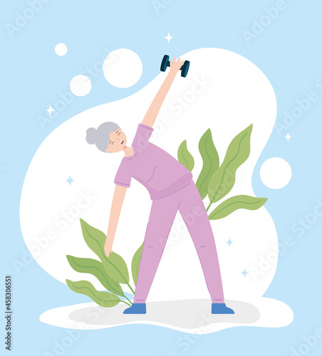 happy old woman with dumbbell