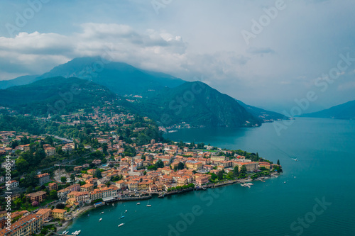 Aerial view of Menaggio village on a cloudy day. Menaggio is a picturesque and traditional village, located on the western shore of Lake Como, Italy © Audrius