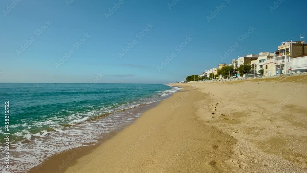 Platja de les Barques sea field Maresme Barcelona Mediterranean coast plane close to turquoise blue transparent water beach without people Platja de les Barques sea field Maresme Barcelona Mediterranean coast plane close to turquoise blue transparent water beach without people