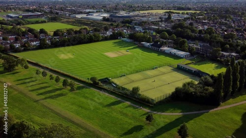 A beautiful sports pitch in an English town. Static aerial drone shot photo