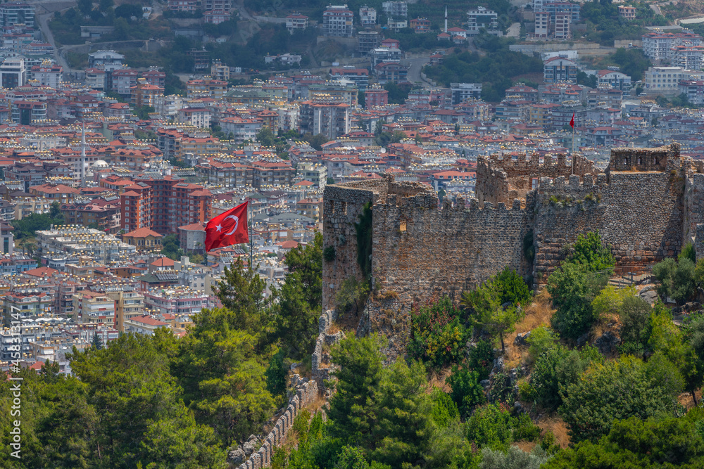 Fragments of the fortifications of a medieval fortress on a hill above the Turkish city of Alanya