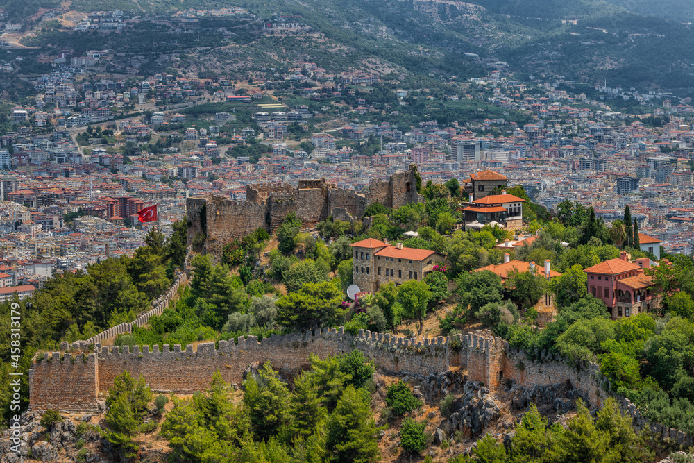 Fragments of the fortifications of a medieval fortress on a hill above the Turkish city of Alanya