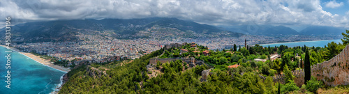 Fragments of the fortifications of a medieval fortress on a hill above the Turkish city of Alanya